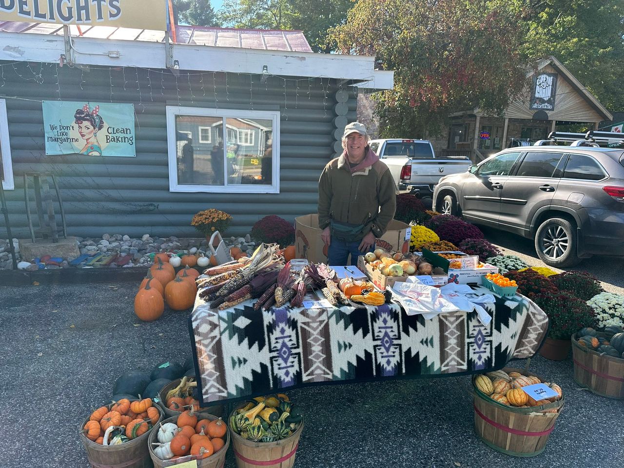 Pumpkins and fall decor displayed outside a local shop