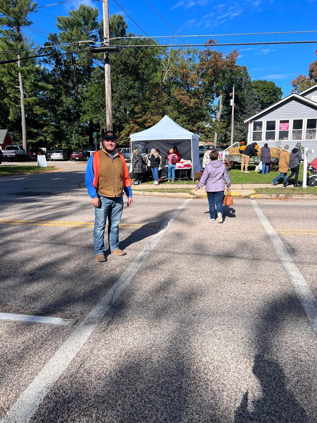 Crowds strolling the King strip past vendor tents at 715 Harvest Fest