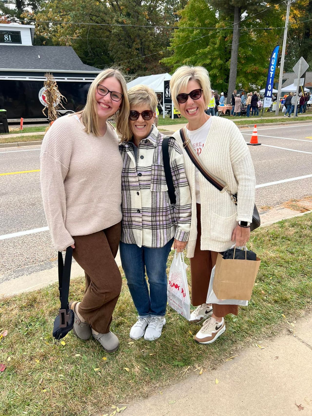 Friends enjoying a sunny day at 715 Harvest Fest