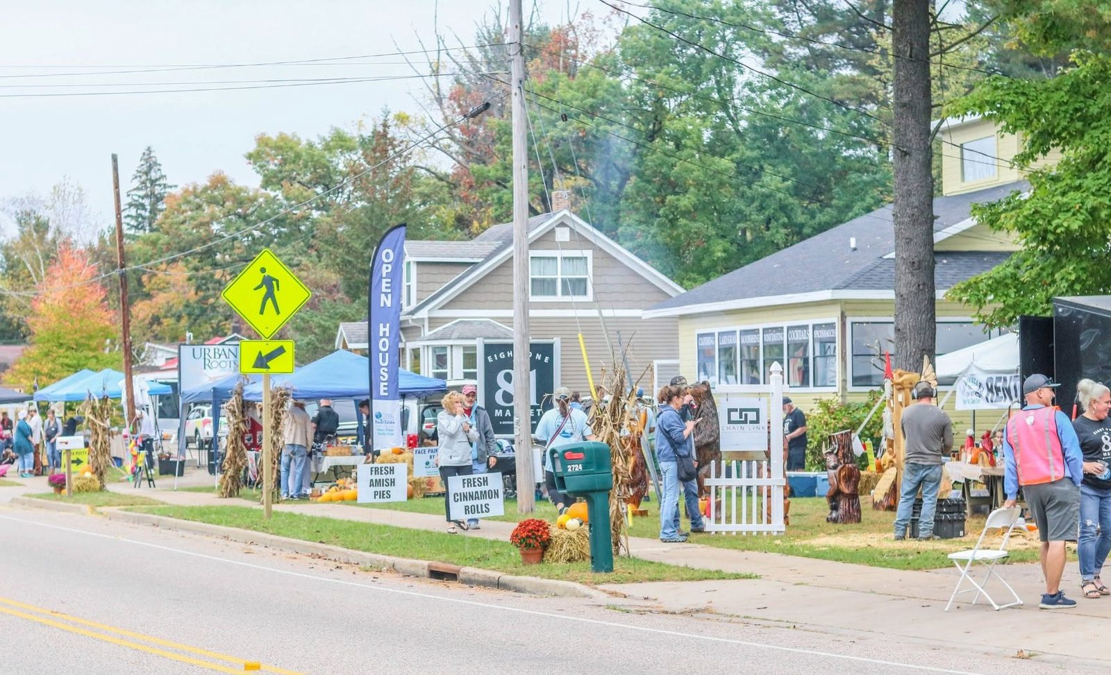 Vendor tents and open houses lining the King strip during 715 Harvest Fest