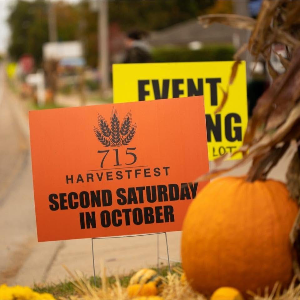 715 Harvest Fest "Second Saturday in October" yard sign beside a pumpkin